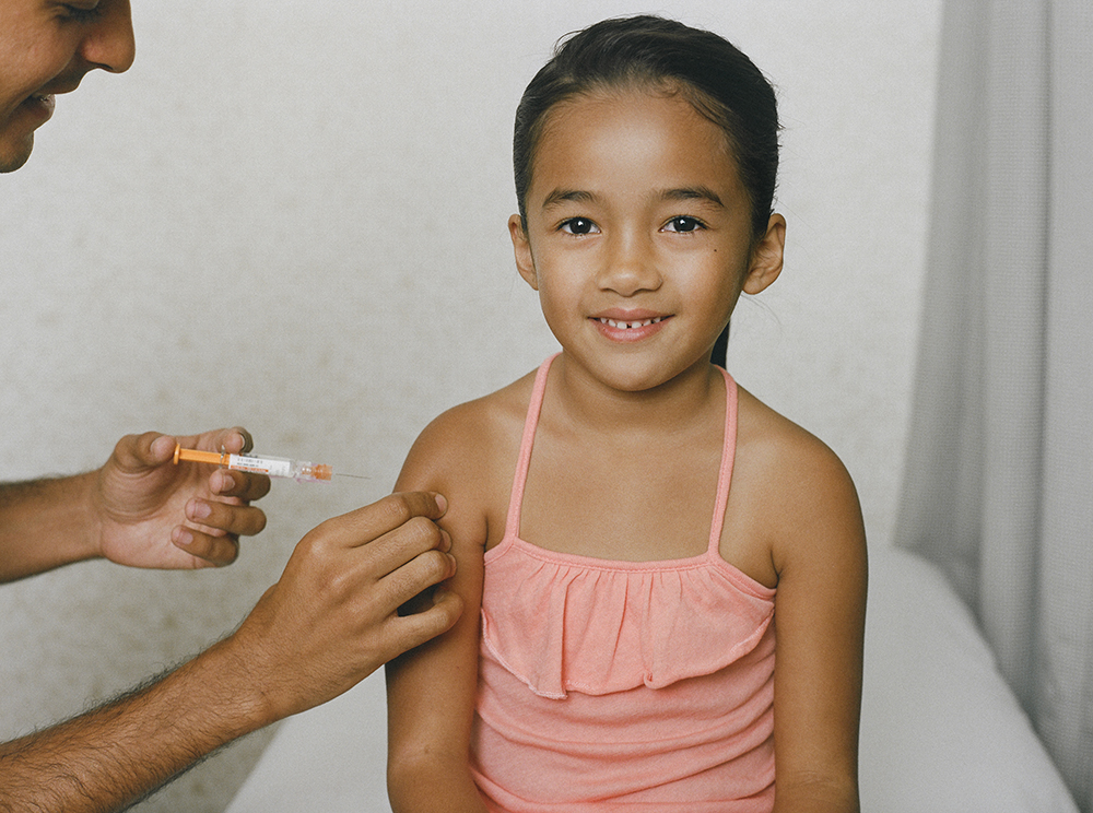 A child receiving a vaccine. SchoolVaxView featured image