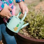 Child watering plants