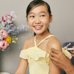 a young woman receiving a vaccine