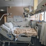 an empty hospital bed. featured image for story on us life expectancy